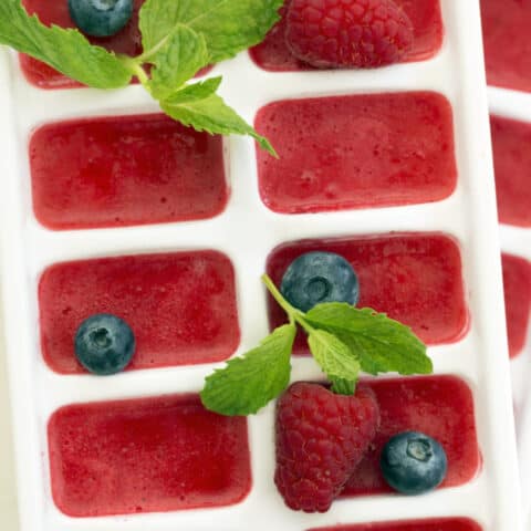 These Summer Berry Ice Cubes are made with fruit puree and add a refreshing pop of flavor and extra antioxidant benefits to a glass of water or tea