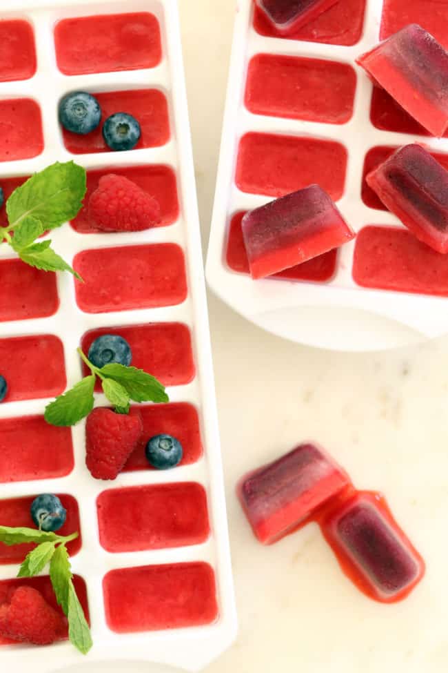 These Summer Berry Ice Cubes are made with fruit puree and add a refreshing pop of flavor and extra antioxidant benefits to a glass of water or tea