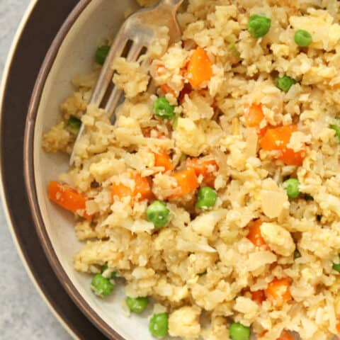 This Cauliflower Fried Rice is a healthy low-carb take on fried rice that's quick and easy to make and tastes as good as take-out