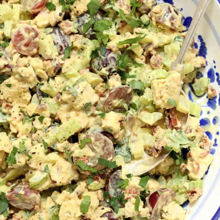 a blue and white bowl filled with chicken salad