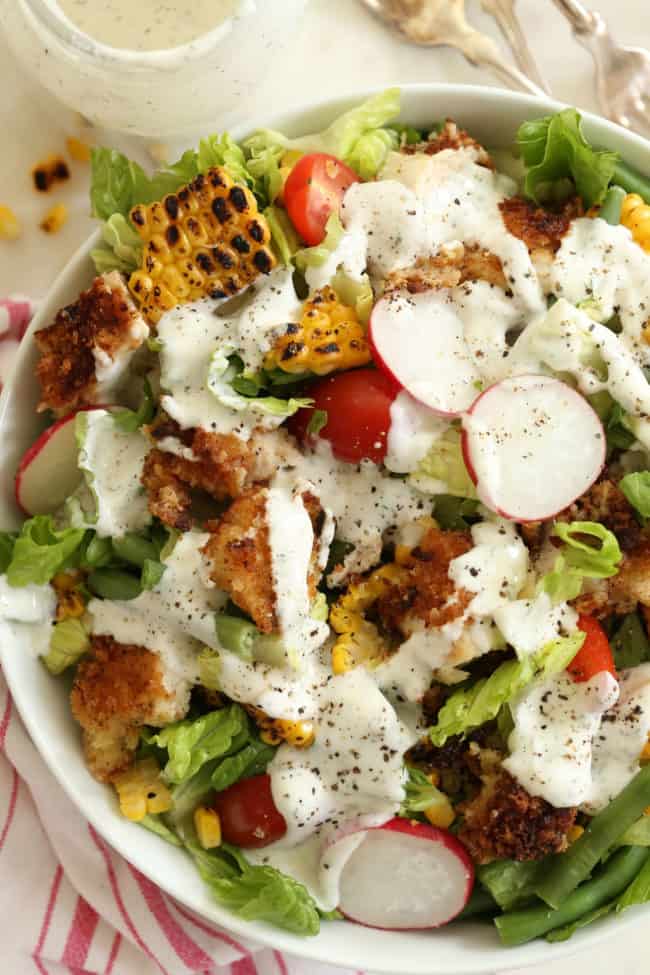 white bowl filled with crispy fried chicken salad