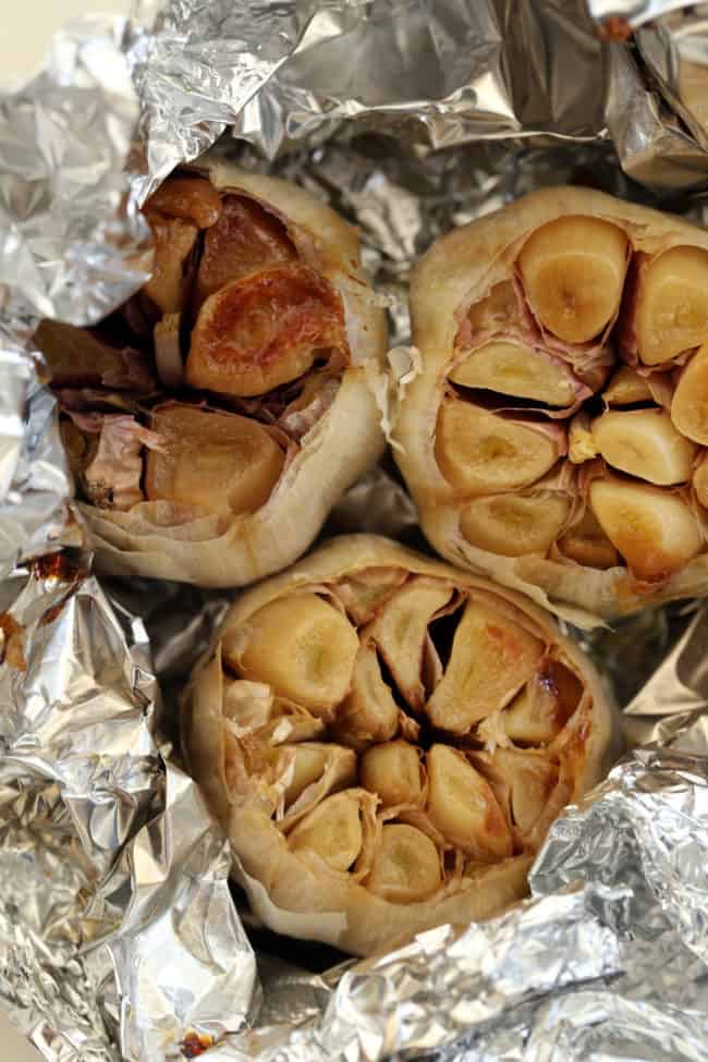 Roasted garlic in aluminum foil.