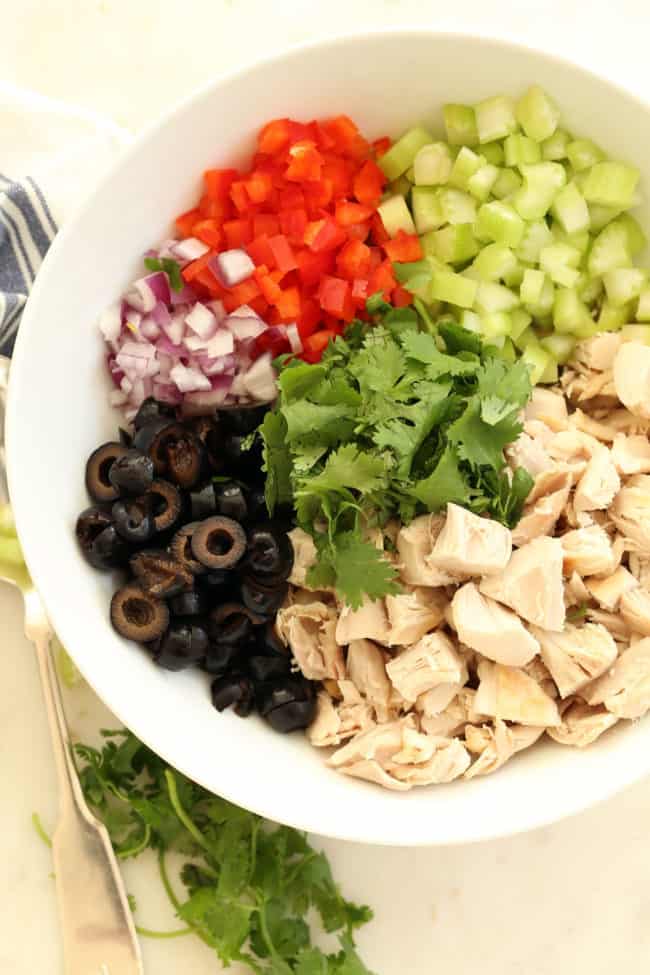 Avocado Chicken Salad is an easy chicken and avocado salad made with chicken, vegetables and black olives all tossed in a vegan avocado mayo