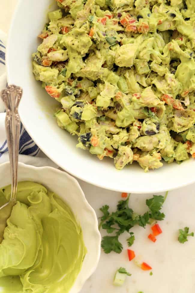 A white bowl filled chopped vegetables.