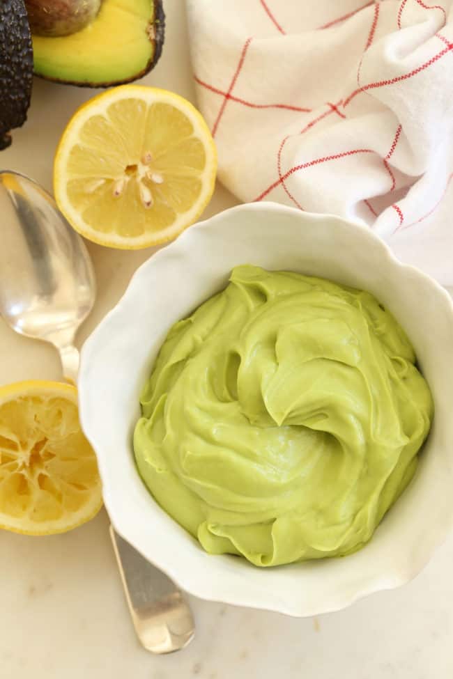 A white bowl filled with blended fruit butter.