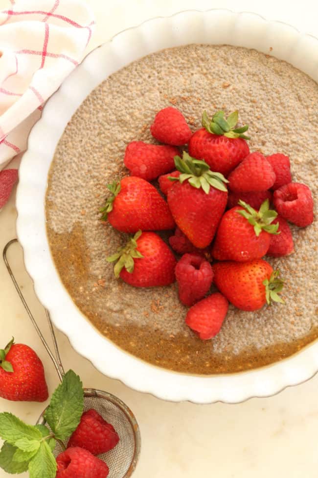 A white dish filled with chocolate chia seed pudding.