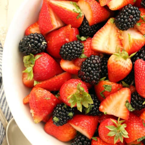 This delicious Summer Berry Salad with Honey Lemon Dressing and basil is an easy fruit salad to pull together