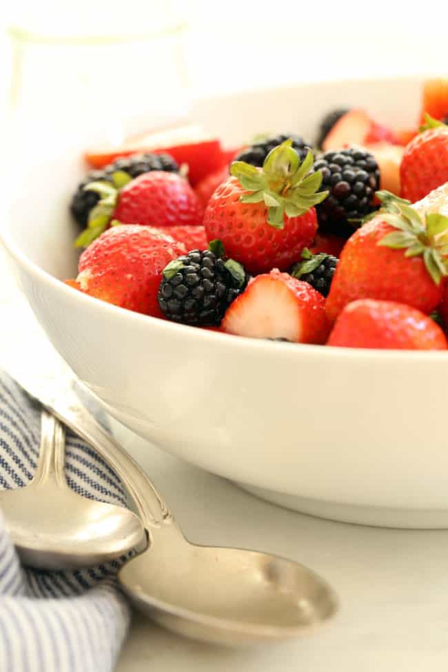 white bowl of berry salad