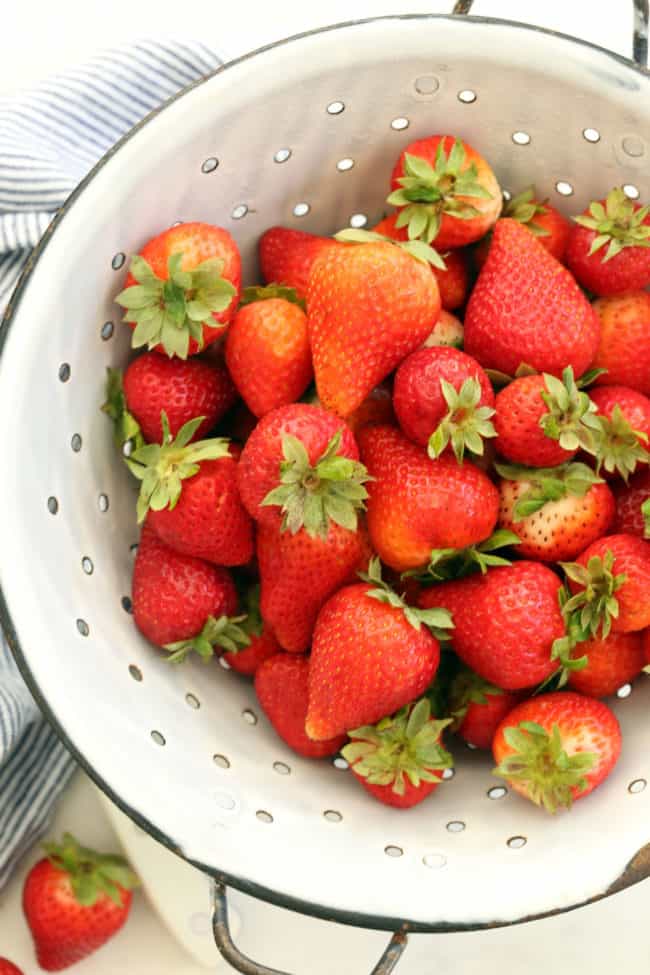 colander filled with fresh strawberries