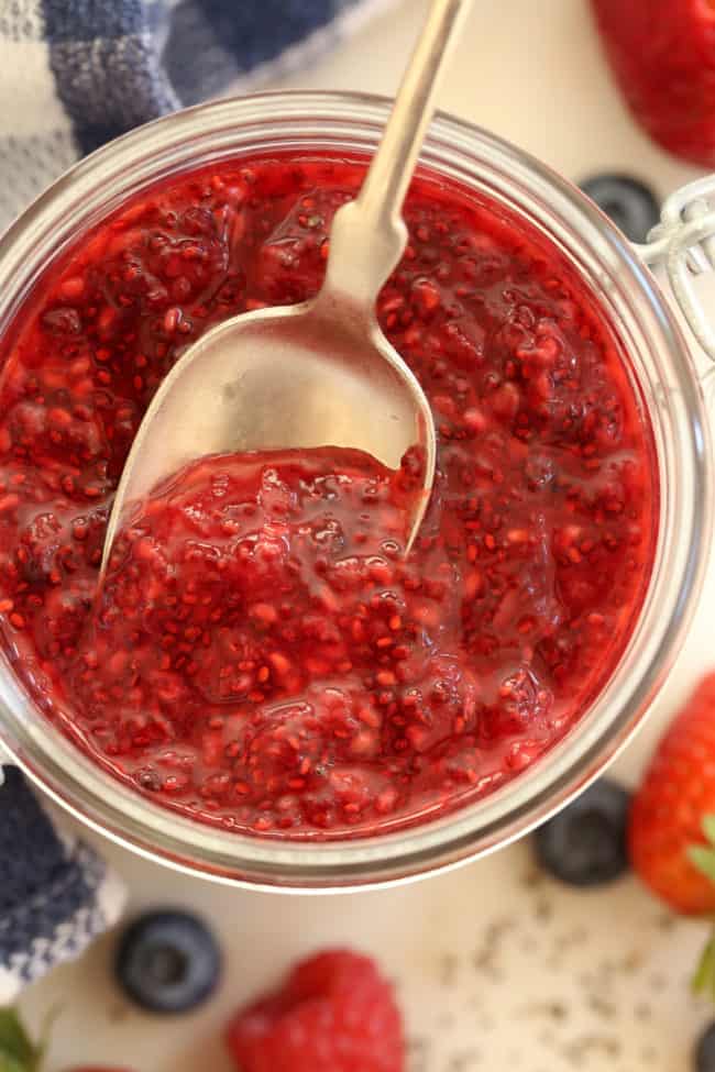 A clear glass mason jar filled with homemade chia jam.