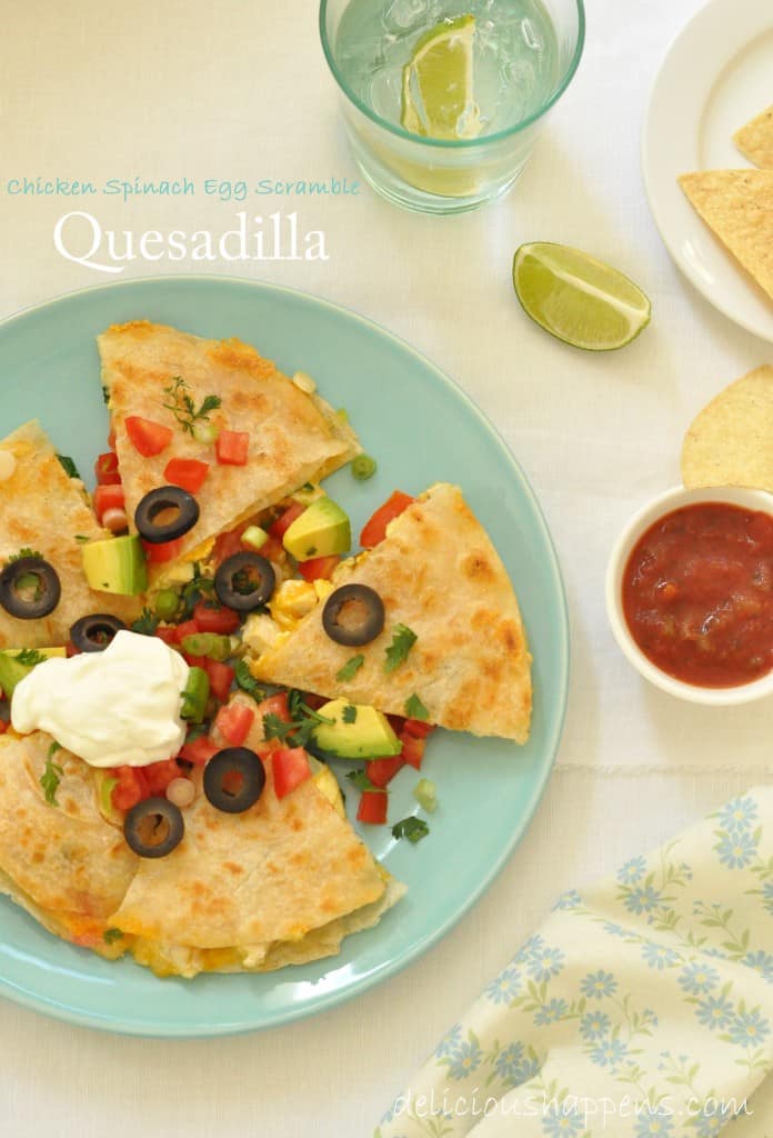 A green plate filled with a quesadilla cut into 5 wedges.