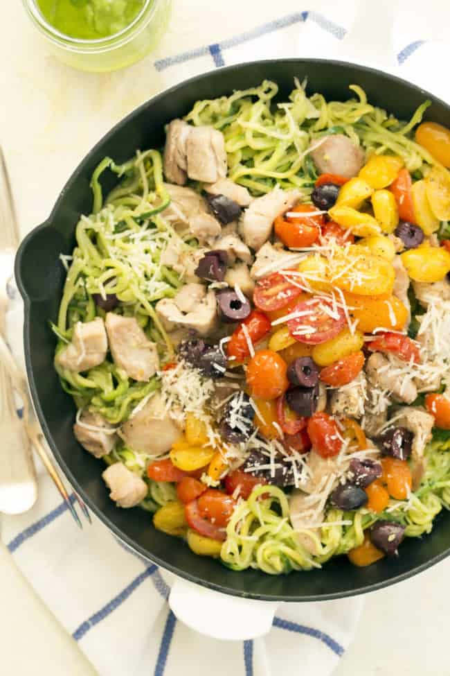 This delicious Pesto Zucchini Noodles with Chicken and pan-roasted tomatoes is a quick and easy chicken dinner you can make any night of the week