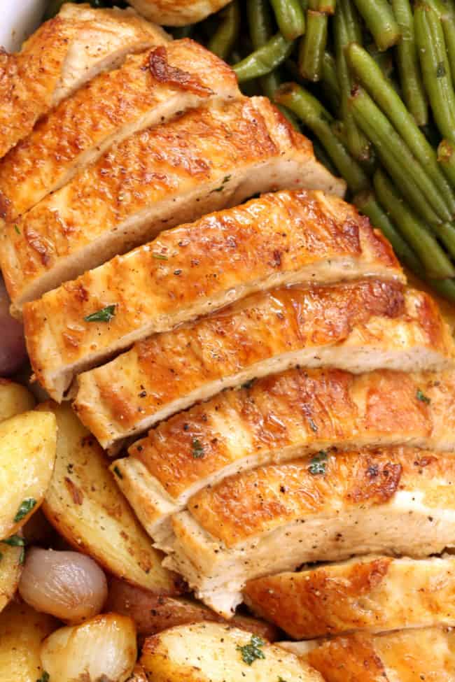 pan with roast turkey breast and vegetables