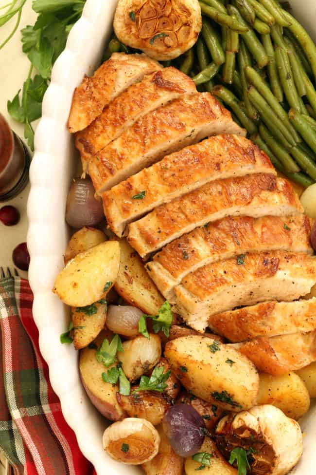 pan of roast turkey breast with vegetables