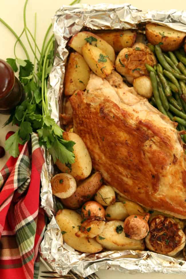 pan of roast turkey breast and vegetables