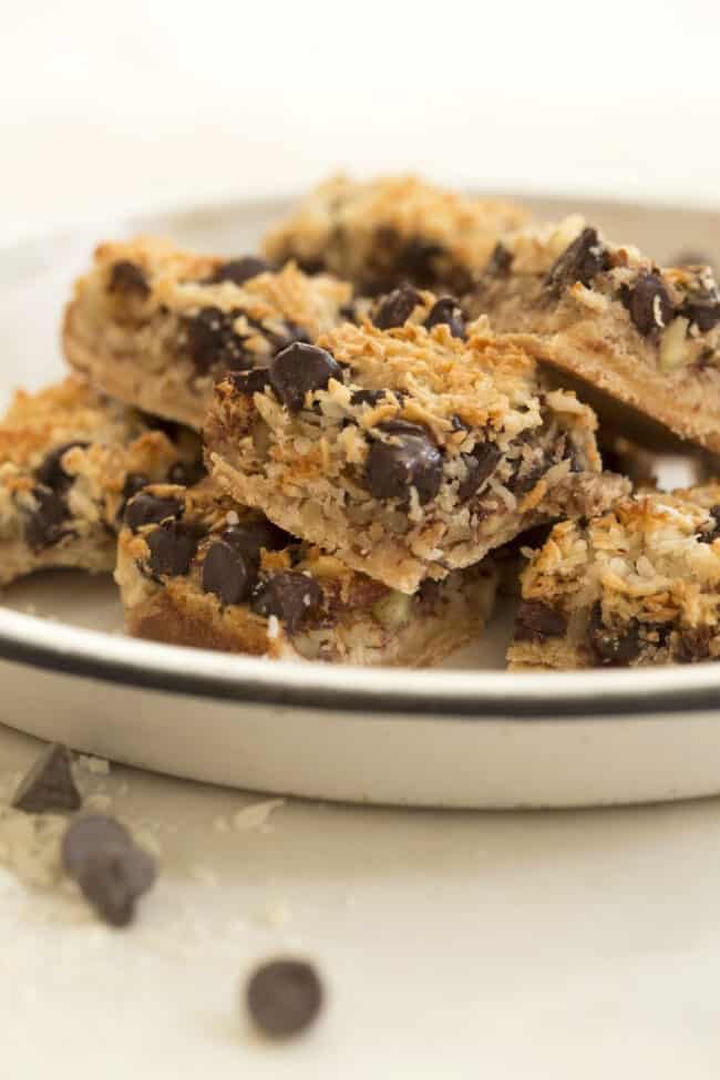A white plate filled with magic cookie bars