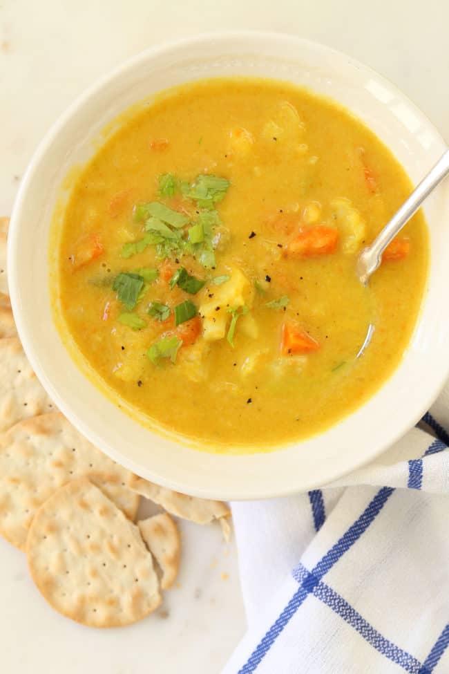 A white bowl filled with Cauliflower Chowder.