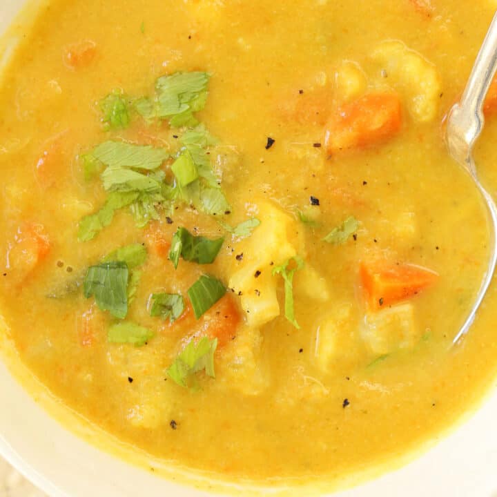 A white bowl filled with Cauliflower Chowder.