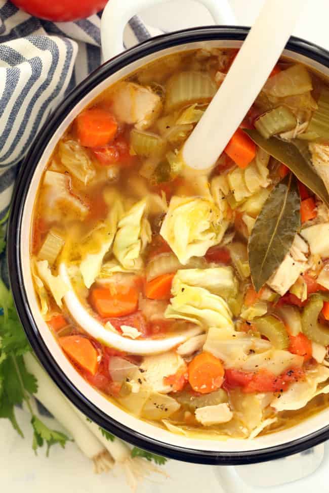 This Mexican Chicken Soup with Cilantro Jalapeno Pesto is crowded with carrots, celery and green cabbage and seasoned with classic Mexican flavors