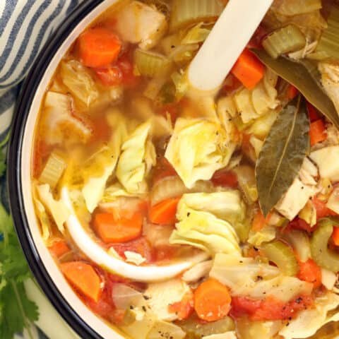 A white pot filled with Mexican Chicken Vegetable Soup.