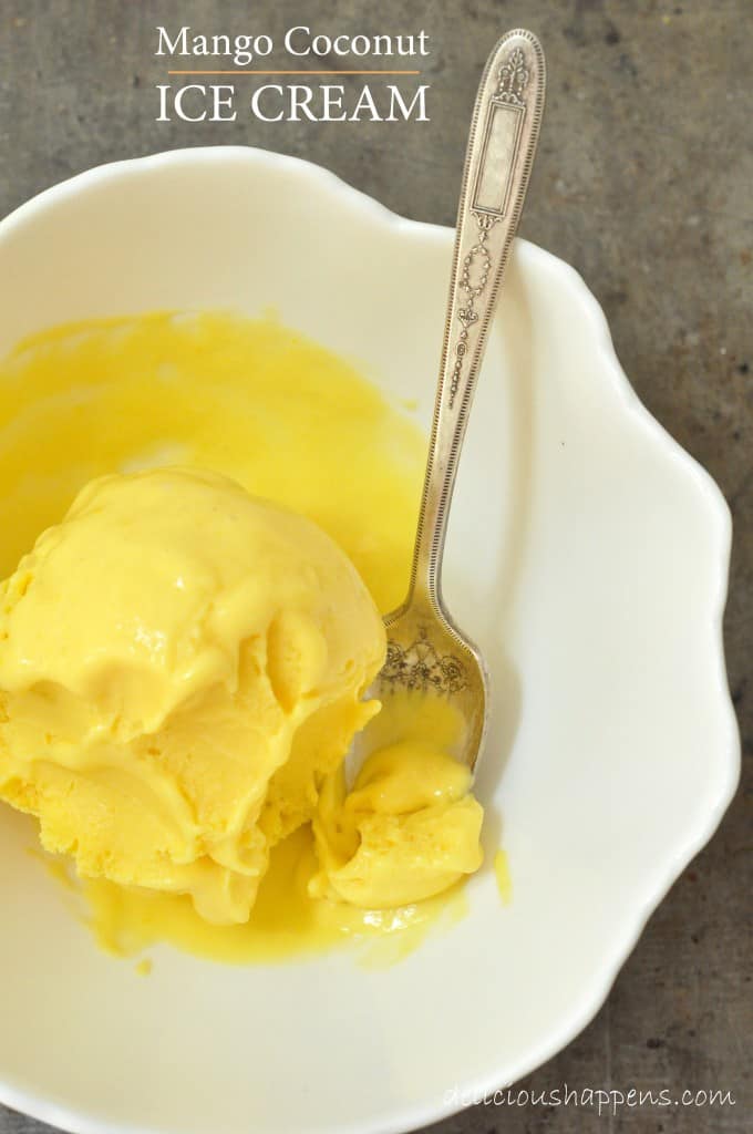 A white bowl filled with mango ice cream.