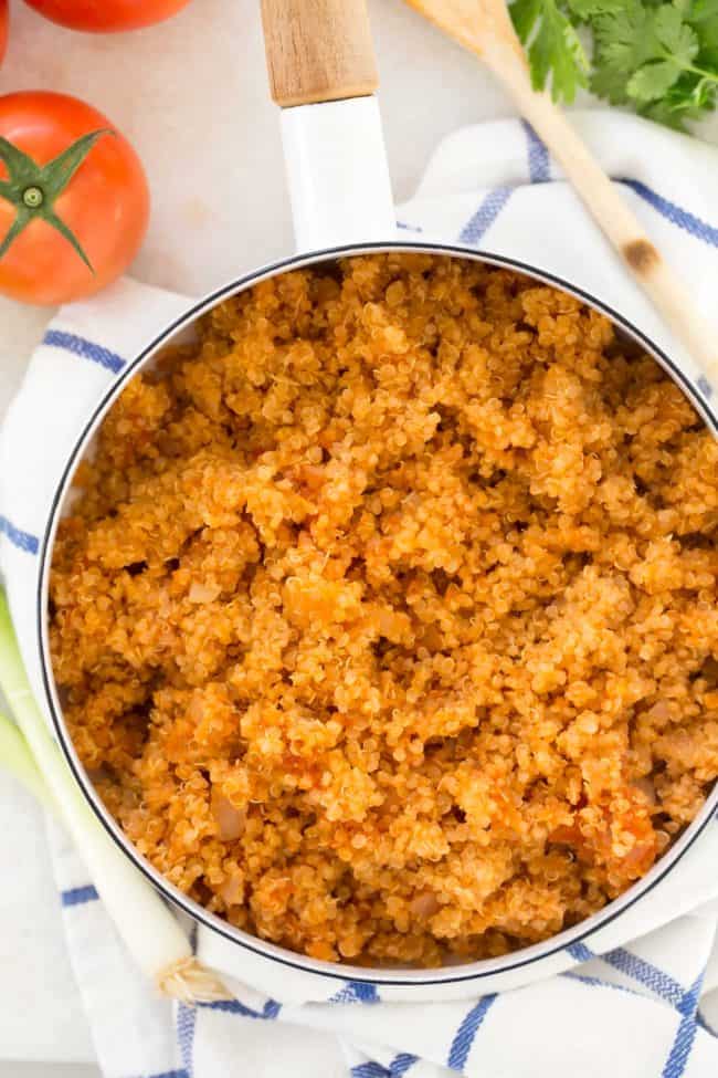 A white pot filled with cooked Spanish quinoa.