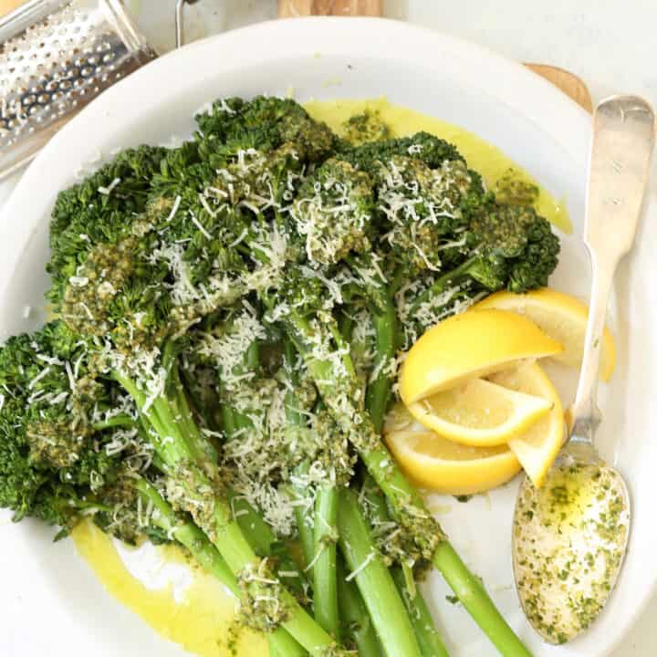 A white plate filled with Basil Pesto Broccoli.
