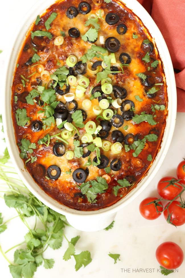 This crowd-pleasing Enchilada Style Baked Chicken is loaded with black beans, corn, tomatoes and a delicious enchilada sauce