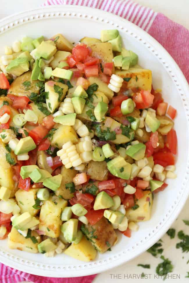 A white bowl filled with Mexican Potato Salad.