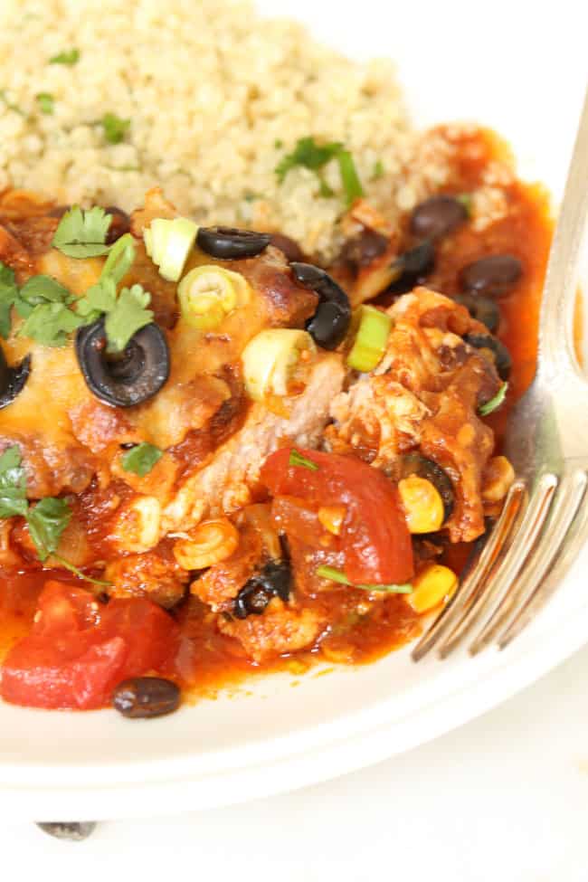A plate filled with chicken enchilada casserole.