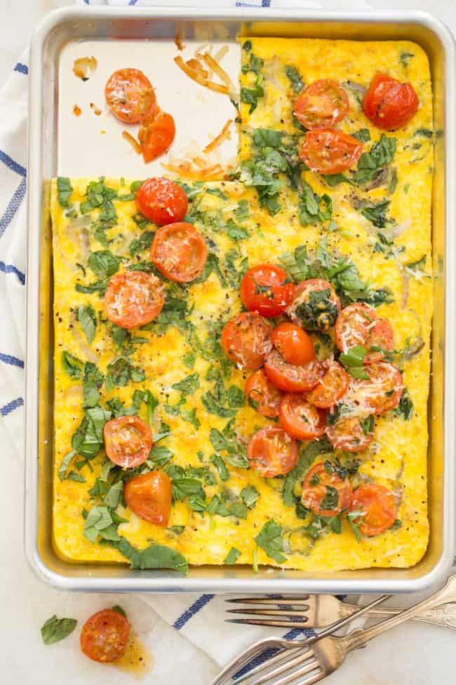 A cookie sheet filled with spinach leek frittata.