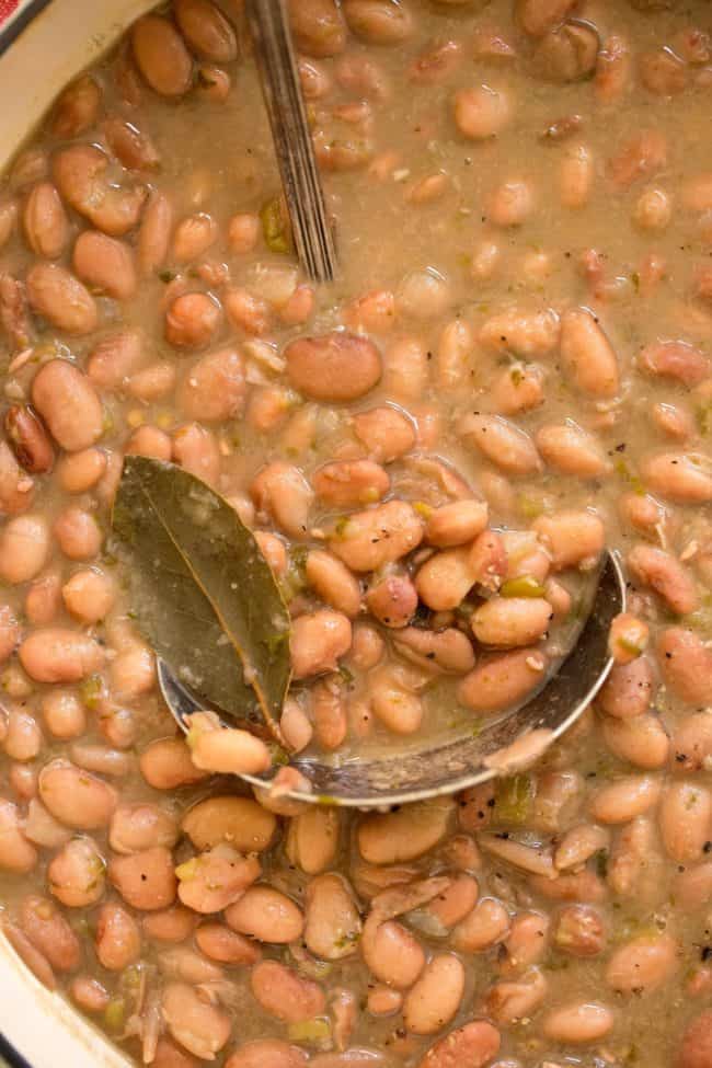 A white pot of cooked beans
