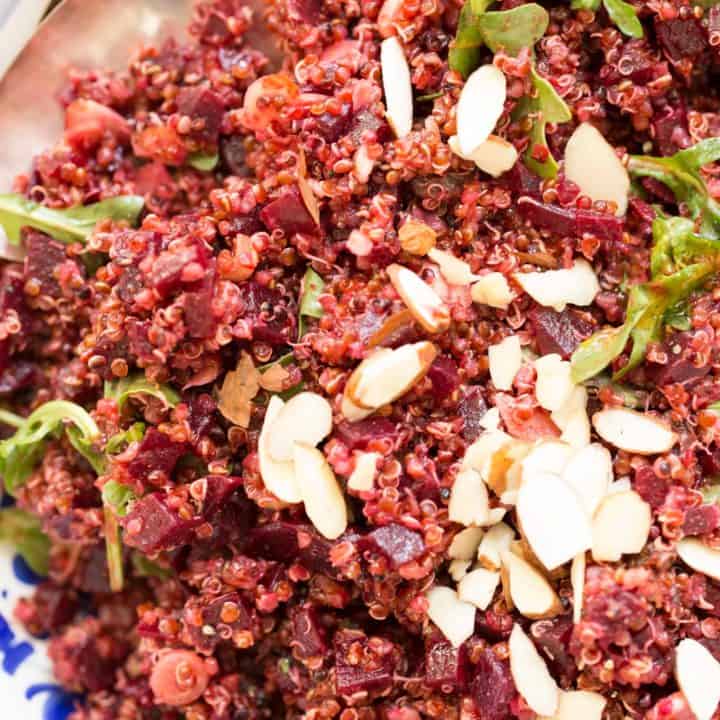 Quinoa Beet Salad is a delicious cold quinoa salad with a mix of red quinoa, chopped beets, arugula, green onion, raisins and sliced almonds