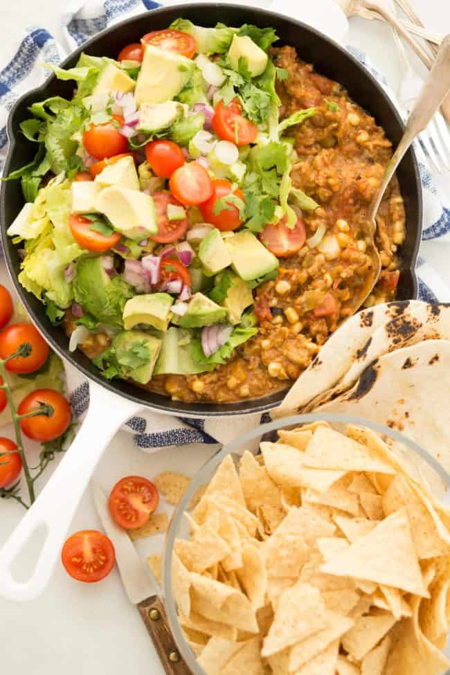This Taco Skillet is made with ground turkey, beans, corn and salsa and makes the best turkey tacos, turkey taco bowls and turkey taco dip