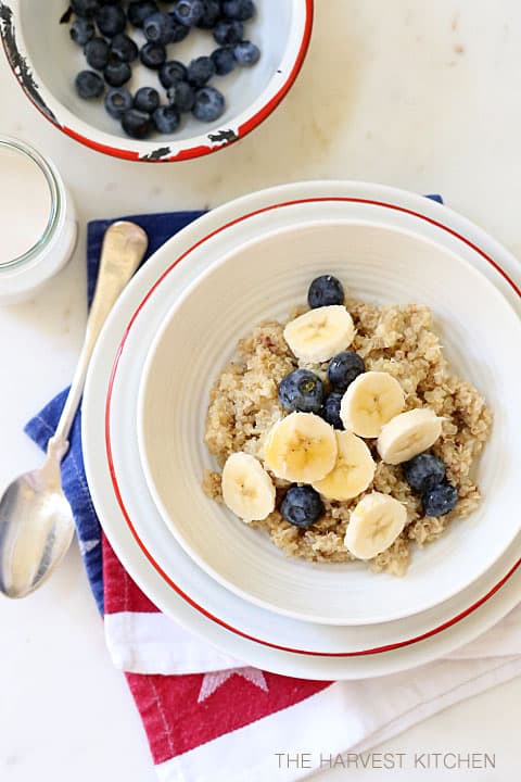 A white bowl of hot quinoa cereal.