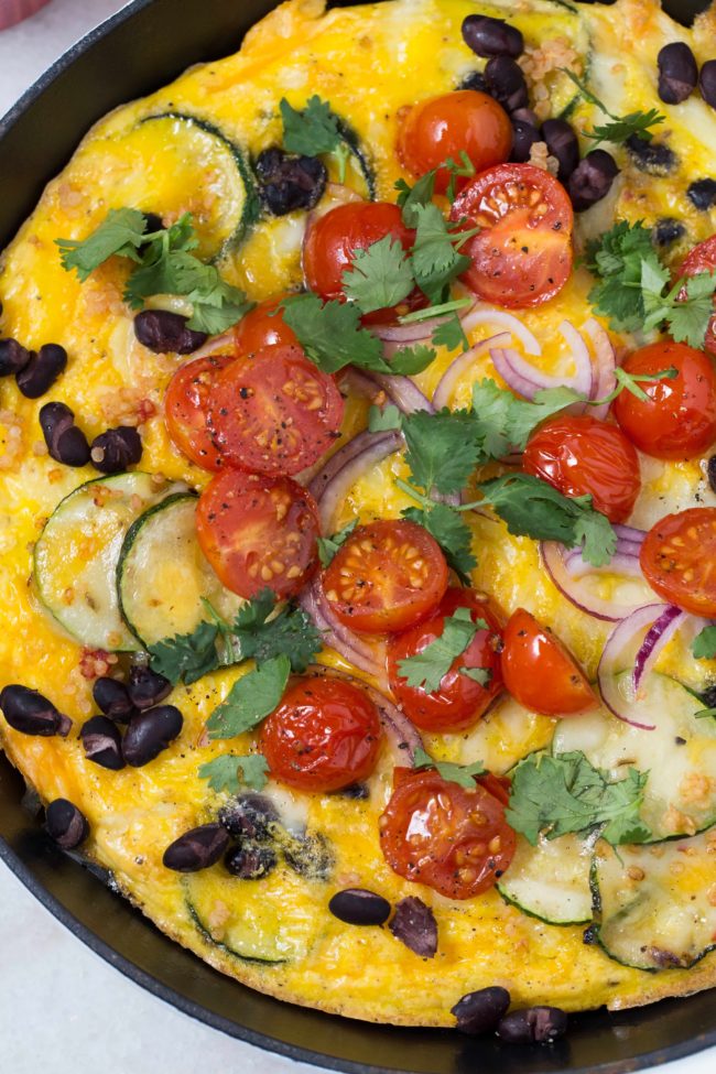 This Spanish Frittata is loaded with zucchini, onion, garlic, black beans, quinoa, a little cheese and of course eggs