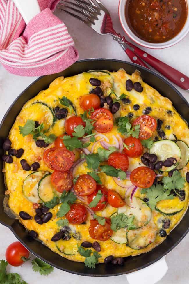 This Spanish Frittata is loaded with zucchini, onion, garlic, black beans, quinoa, a little cheese and of course eggs