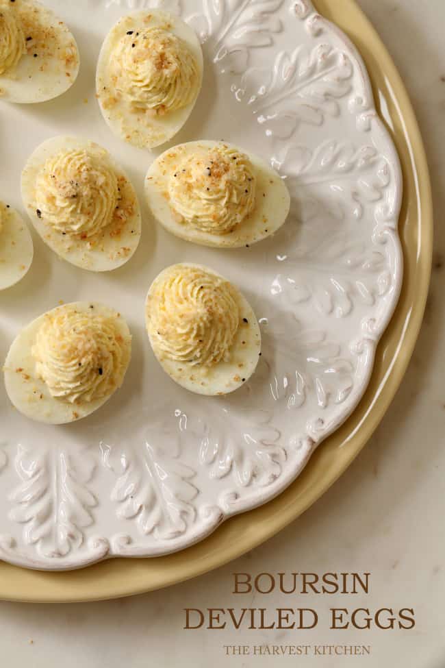 A white plate filled with Boursin Cheese Deviled Eggs.