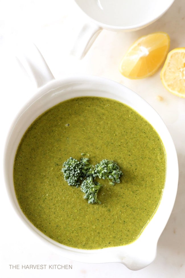 A white bowl filled with Broccoli Soup.