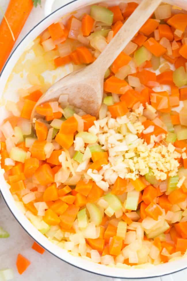 This Carrot Ginger Soup Recipe is made with carrots, celery, onion, ginger and garlic all simmered in a vegetable broth, then blended until smooth and silky