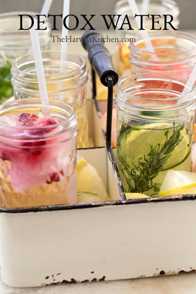 Several glasses with fruit detox water ingredients.