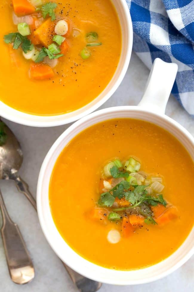 This Carrot Ginger Soup Recipe is made with carrots, celery, onion, ginger and garlic simmered in a vegetable broth, then blended until smooth and silky