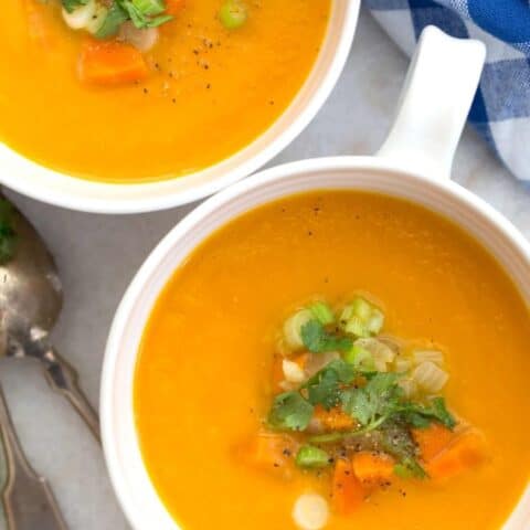 This Carrot Ginger Soup Recipe is made with carrots, celery, onion, ginger and garlic simmered in a vegetable broth, then blended until smooth and silky