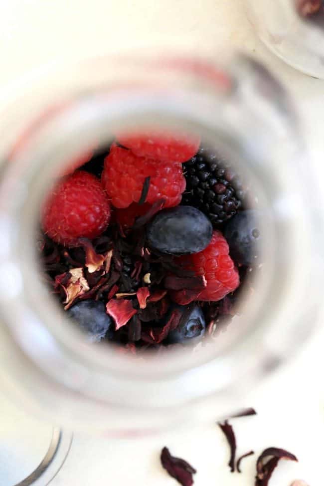 glass filled with dried hibiscus leaves and berries