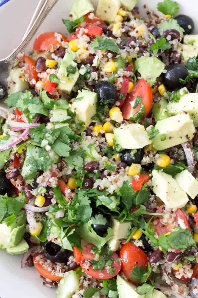 A white bowl filled with Quinoa Black Bean Salad. 