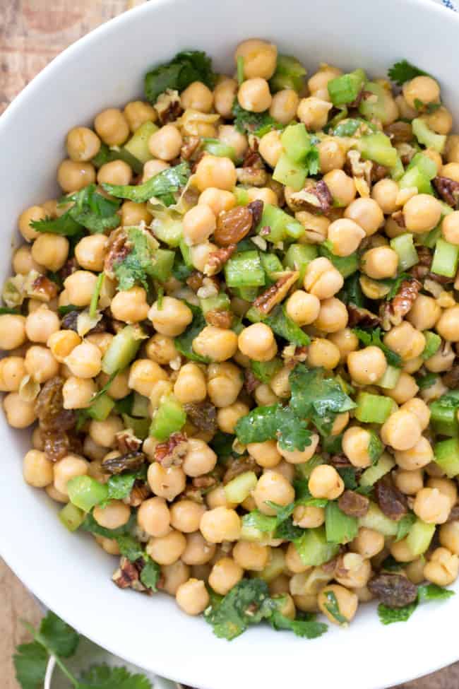 This Curried Chickpea Salad is a simple salad made with garbanzo beans, raisins, pecans, parsley and celery all tossed in a delicious curry salad dressing