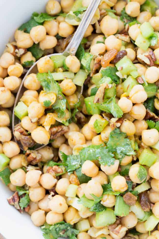 This Curried Chickpea Salad is a simple salad made with garbanzo beans, raisins, pecans, parsley and celery all tossed in a delicious curry salad dressing