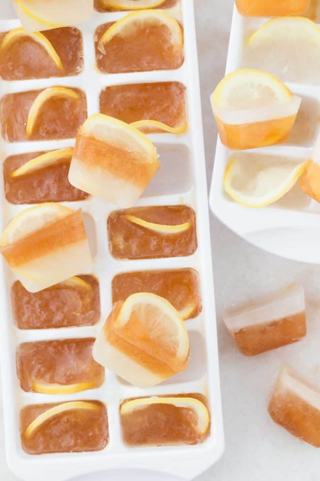 Two white ice cube trays filled with Arnold Palmer Ice Cubes.