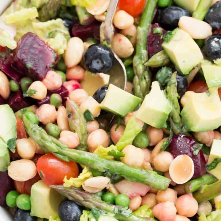 A white bowl filled with vegetable salad.