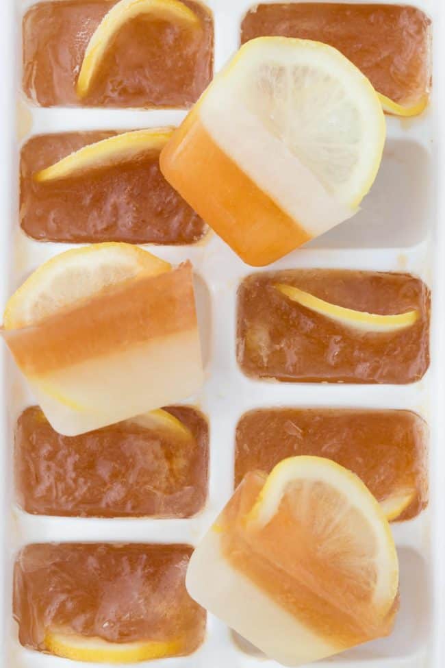 A white ice cube tray filled with Arnold Palmer ice cubes (sweet tea ice cubes).